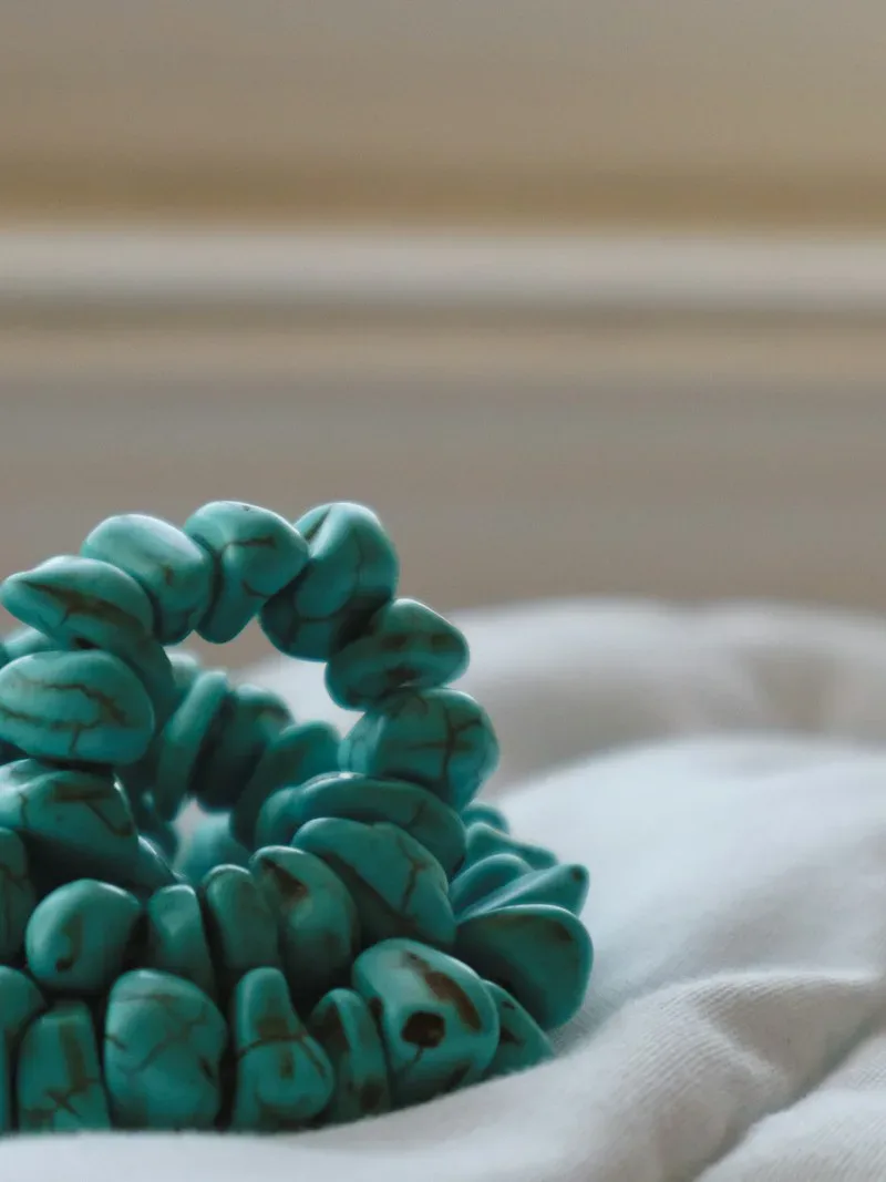 Turquoise necklace detail with brown heishi beads